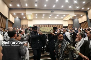 گزارش تصویری | بدرقه پیکر شهید گمنام دفاع مقدس در همایش سالیانه بسیجیان در مشهد