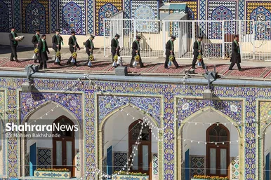 مراسم تعویض پرچم گنبد و پوش ضریح حرم مطهر ثامن الحجج (ع)