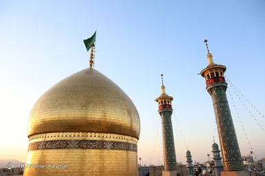 آیین تعویض پرچم گنبد حرم حضرت معصومه(س)