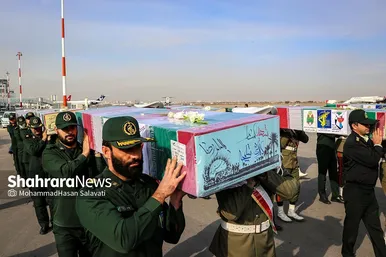 استقبال از پیکر مطهر ۱۲ شهید گمنام دفاع مقدس در فرودگاه هاشمی نژاد مشهد