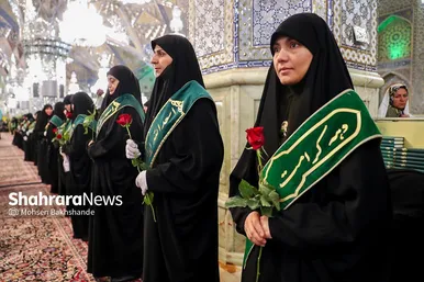 مراسم تعویض پرچم گنبد و پوش ضریح حرم مطهر ثامن الحجج (ع)