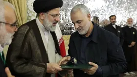فیلم/ اعطای حکم خادمی امام رضا (ع) به سپهبد قاسم سلیمانی