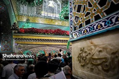 مراسم تعویض پرچم گنبد و پوش ضریح حرم مطهر ثامن الحجج (ع)