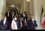 ظریف با ملابرادر دیدار کرد | اعلام آمادگی ایران برای تسهیل در گفت‌وگوهای بین افغان‌ها + عکس