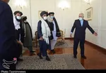 ظریف با ملابرادر دیدار کرد | اعلام آمادگی ایران برای تسهیل در گفت‌وگوهای بین افغان‌ها + عکس