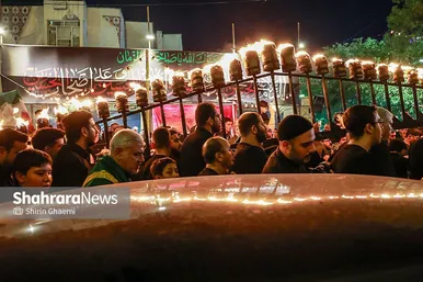 گزارش تصویری | آیین مشعل گردانی نجفی های مقیم مشهد در شب عاشورا