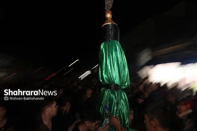 عکس‌هایی از مراسم علم کشیِ مهاجران افغانستانی در گلشهر مشهد