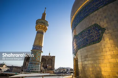 آیین تعویض پرچم گنبد منور حرم مطهر رضوی