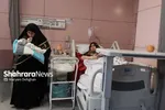 روایتی از حضور بانوان خادم کنار نوزادان تازه‌متولدشده | اشک‌های شوق مادرانه روی پرچم متبرک حرم مطهر رضوی + عکس و فیلم