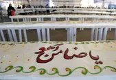 توزیع کیک ۱۰۰۰ متری میلاد امام‌رضا(ع) در حرم مطهر رضوی