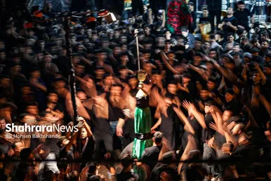 عکس‌هایی از مراسم علم کشیِ مهاجران افغانستانی در گلشهر مشهد