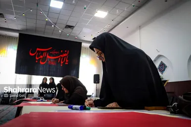 گزارش تصویری | پویش مردمی پلاکاردنویسی «باید برخاست»