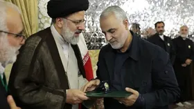 فیلم/ اعطای حکم خادمی امام رضا (ع) به سپهبد قاسم سلیمانی