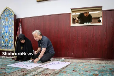 گزارش تصویری | پویش مردمی پلاکاردنویسی «باید برخاست»