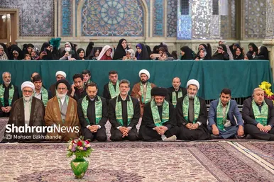 مراسم تعویض پرچم گنبد و پوش ضریح حرم مطهر ثامن الحجج (ع)
