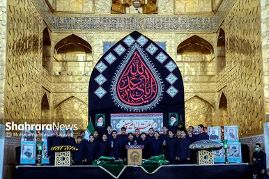 اهتزاز پرچم عزای حسینی بر فراز گنبد حرم رضوی