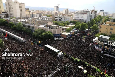 حضور مهاجران افغانستان در مراسم خاکسپاری رئیس‌جمهور شهید در مشهد