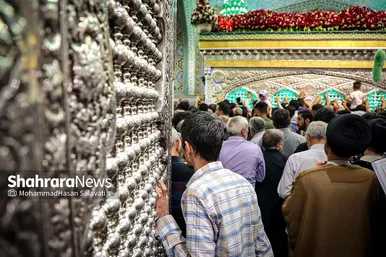 مراسم تعویض پرچم گنبد و پوش ضریح حرم مطهر ثامن الحجج (ع)
