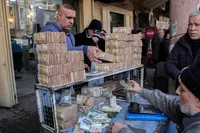 دلار در بازار عراق در محدوده ۱۶۷ هزار دینار | واکنش بازار‌ها به کاهش ارزش دینار ادامه دارد
