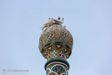 آیین تعویض پرچم گنبد حرم حضرت معصومه(س)