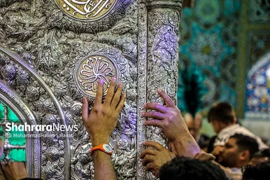مراسم تعویض پرچم گنبد و پوش ضریح حرم مطهر ثامن الحجج (ع)