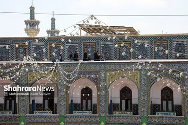 مجموعه عکس | تعویض پرچم گنبد مطهر رضوی به احترام شهادت رئیس جمهور و هیئت همراه