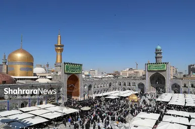 مراسم تعویض پرچم گنبد و پوش ضریح حرم مطهر ثامن الحجج (ع)