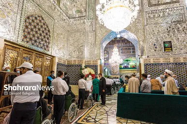 آیین تعویض پرچم گنبد منور حرم مطهر رضوی