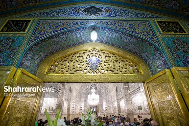 آیین تعویض پرچم گنبد منور حرم مطهر رضوی