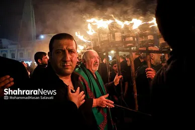 تصاویری از آئین سنتی مشعل گردانی نجفی‌های مقیم مشهد