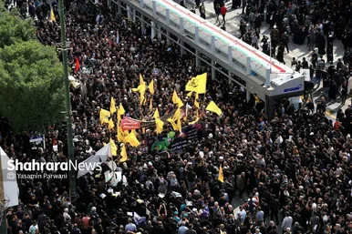 حضور مهاجران افغانستان در مراسم خاکسپاری رئیس‌جمهور شهید در مشهد