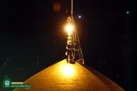 پرچم گنبد و پوش ضریح حرم مطهر رضوی تعویض شد