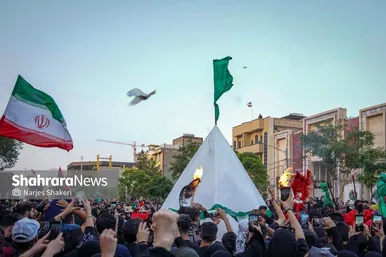 گزارش تصویری | آیین خیمه سوزان عصر عاشورا در بلوار هاشمیه مشهد (۴ تیر ۱۴۰۵)