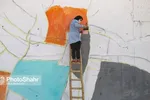 مشهد با نصب نماد‌ها و نشانه‌های هنری برای نوروز ۱۴۰۰ آماده می‌شود + تصاویر